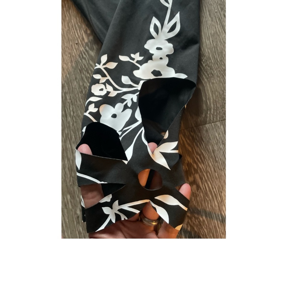 WORN ONCE! SUPER CUTE CAPRI PANTS WITH FLORAL HEM AND HOLE ACCENTS! - Picture 5 of 9